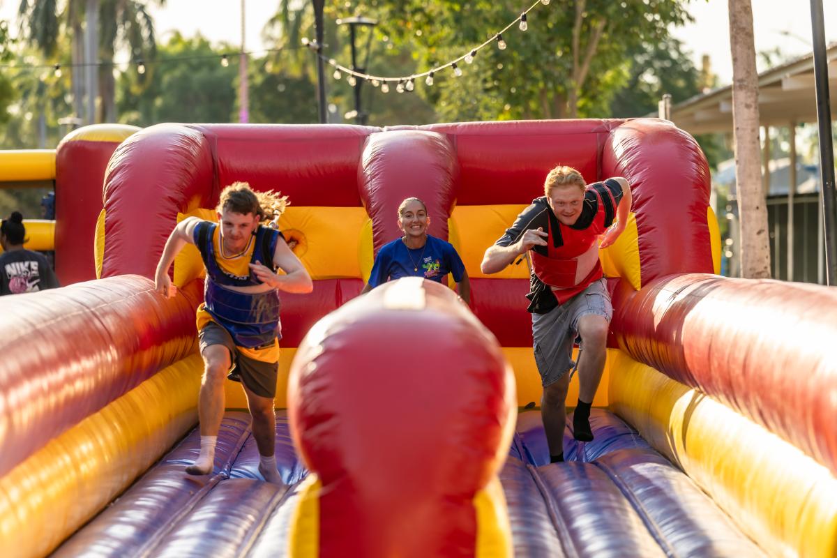 Youth competiting on inflatable