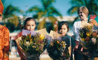 Children holding flowers