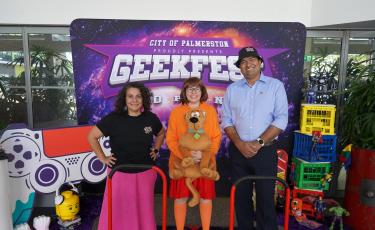 Image: Mayor & Minister Charls in front of Geekfest sign