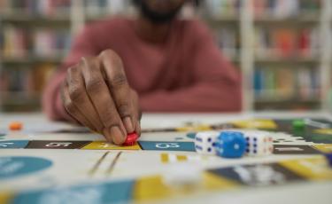 Image of person winning a board game