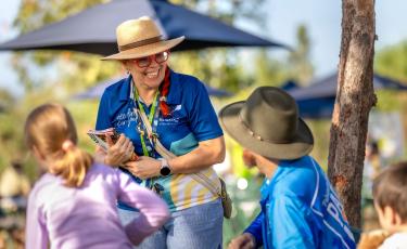 Image: consultation. Smiling at community members