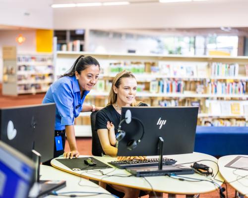 Image: Woman on computer with CoP support