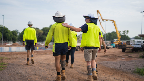 Image: men in contruction wear walking 