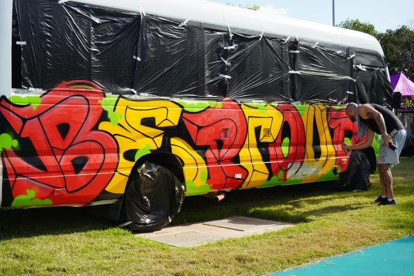 Image: bus spray painted with be proud 