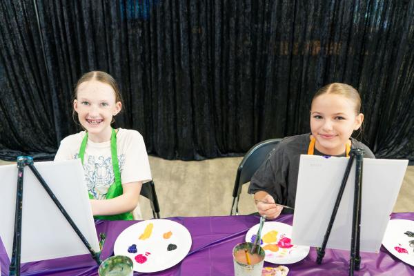 image: two girls painitng 