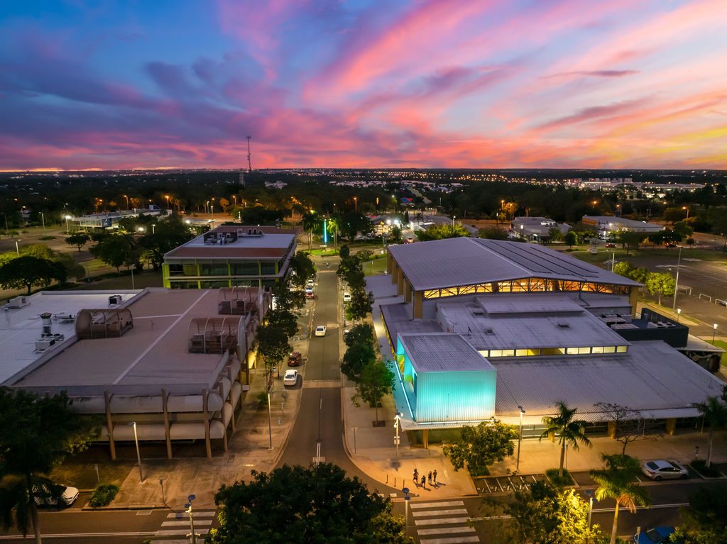 Aerial view over the CBD with Recreation Centre Illuminated in blue